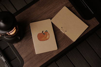 Notepad “Persimmon and Caterpillar” designed by Ava