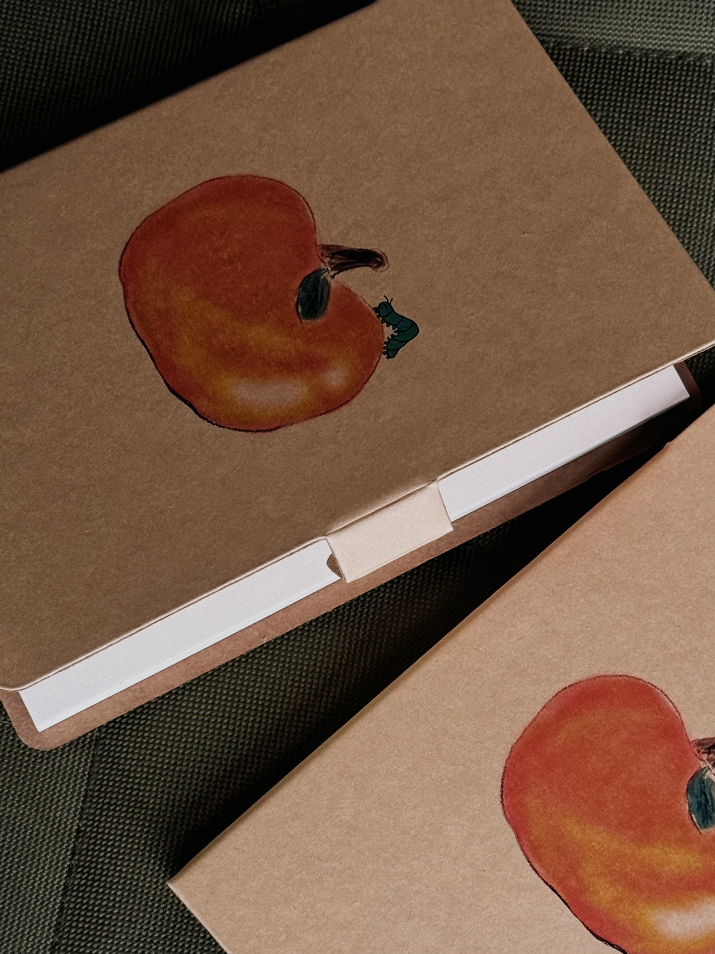 Notepad “Persimmon and Caterpillar” designed by Ava